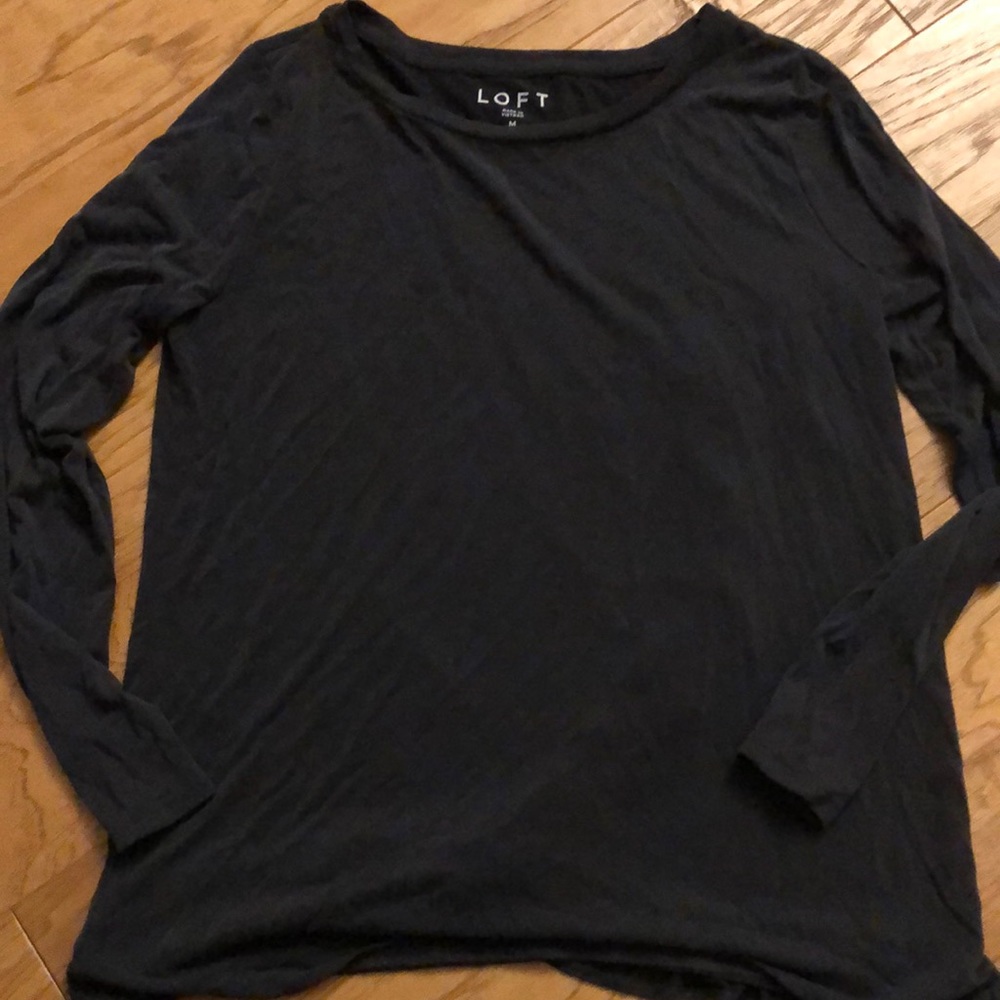 Grayish black loft long sleeve top with ruffle detail along back